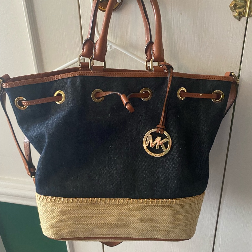 Michael Kors denim bucket bag with jute bottom.